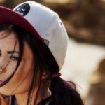 Young_brunette_woman_in_a_cap_and_a_with_piercing_nose_047444_